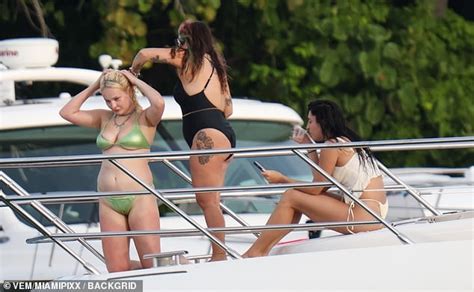 Kim Petras is gorgeous in tiny green bikini as she enjoys some fun in the sun with pals on yacht ...