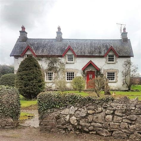 Irish Countryside Home with Red Trim and Chimneys