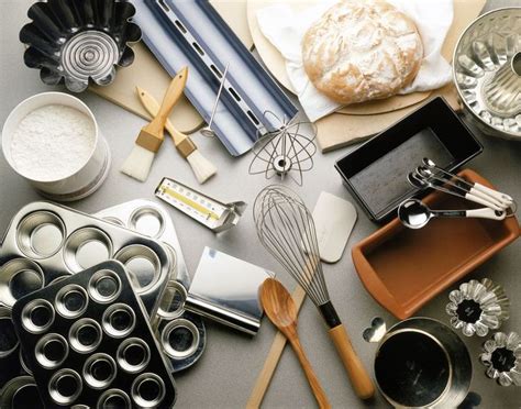 an assortment of kitchen utensils and baking supplies on top of a gray surface