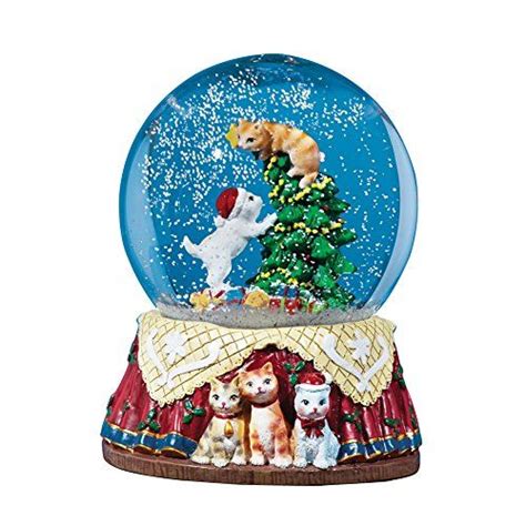 a snow globe with cats and dogs in it