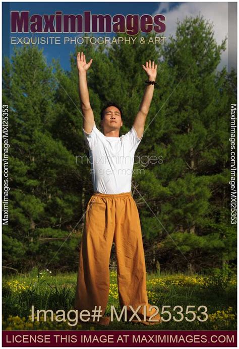 Photo of Man practicing sunrise Qi Gong meditation | Stock Image MXI25353