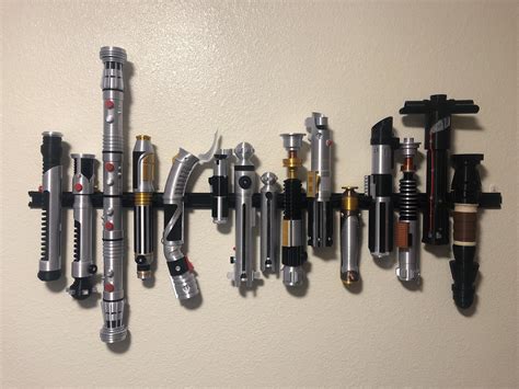 Just finished wall mounting my 3d printed lightsaber set (in canonical order) : r/StarWars