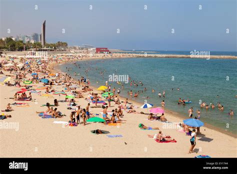 Tourists and local people on Platja Nova Icaria ( Nova Icaria beach ...