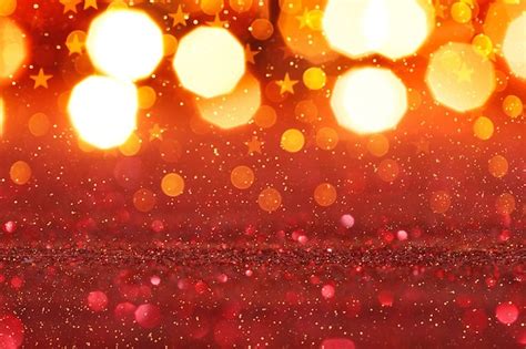 Premium Photo | Abstract red glitter background with gold lights