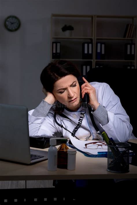 The Aged Female Doctor Working at Night Shift Stock Image - Image of insurance, medical: 146952039