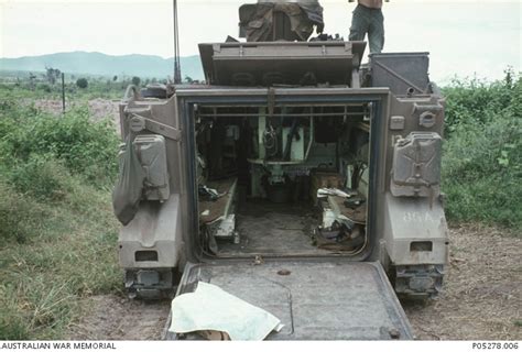 Rear view of the interior of an M113A1 Armoured Personnel Carrier (APC) with the call sign eight ...
