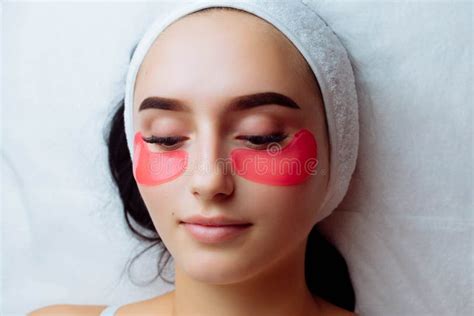 Under Eye Treatment. Woman with Patches Relaxing in Spa Salon Stock Photo - Image of lifting ...
