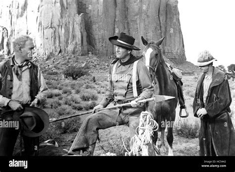 THE SEARCHERS, from left: Harry Carey Jr., John Wayne, Hank Worden, 1956 Stock Photo - Alamy