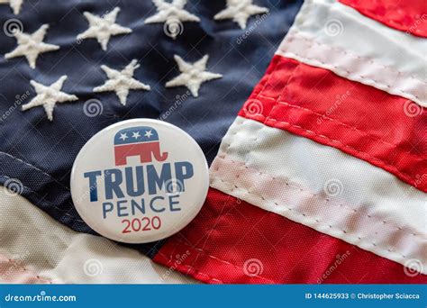 Trump-Pence 2020 Campaign Badge Against United States Flags. Editorial ...