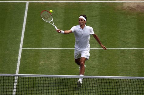 Roger Federer hits a forehand volley against Mikhail Youzhny during their quarter-final match on ...