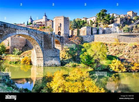 Toledo, Spain. Alcazar and Alcantara Bridge (Puente de Alcantara), an ...