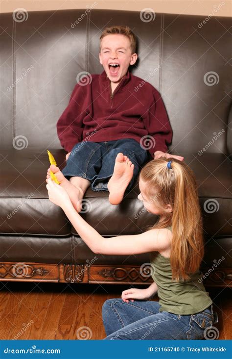 Children Tickling Feet With Feather Stock Photo - Image of love, color: 21165740