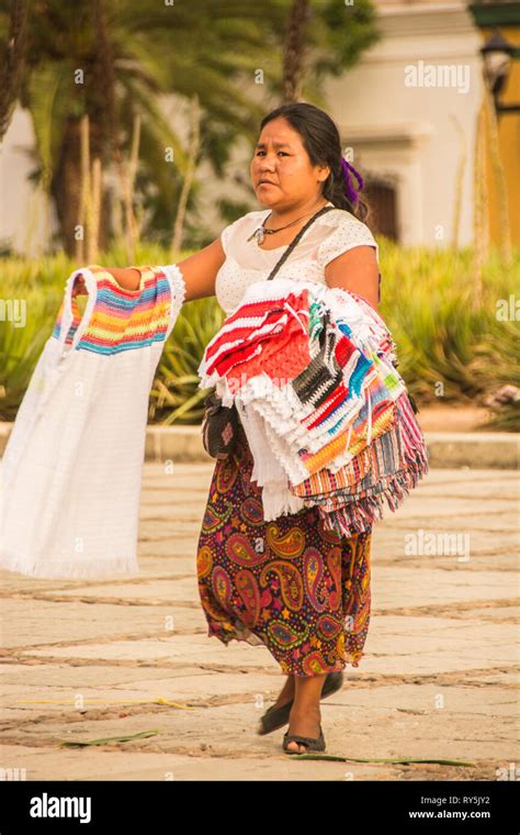 A Oaxacan woman selling dresses in the plaza, Oaxaca, Mexico Stock ...