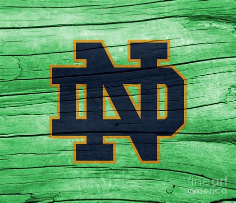 University of Notre Dame Fighting Irish Logo On Green Rustic Wood ...