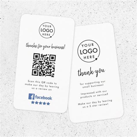 two business cards with qr code printed on the front and back, sitting next to each other