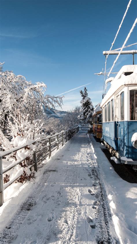 Download wallpaper: Old train covered with snow 1080x1920