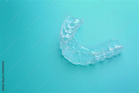 Occlusal splint on color background Stock Photo | Adobe Stock