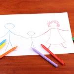 Child drawing with colorful pencils Stock Photo by ©belchonock 62315835