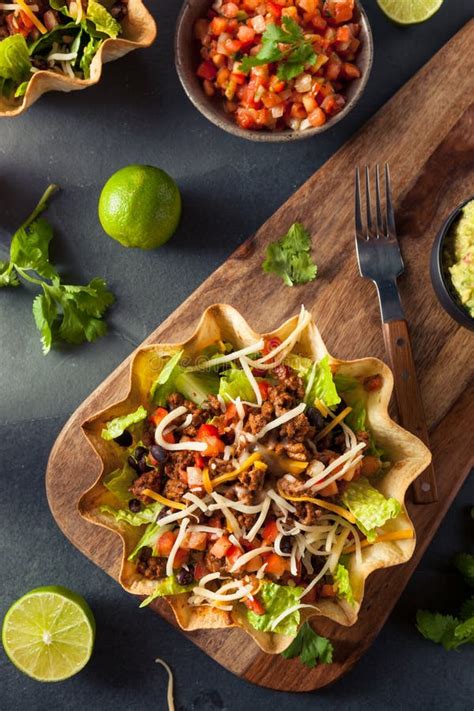 Taco Salad in a Tortilla Bowl Stock Photo - Image of background, chili: 66160284