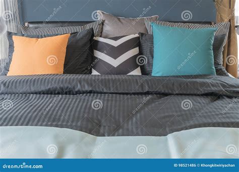 Colorful Pillows on Dark Color Bed in Modern Bedroom Stock Photo ...