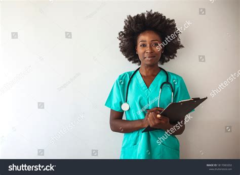 6,098 Black nurse standing in uniform Images, Stock Photos & Vectors ...