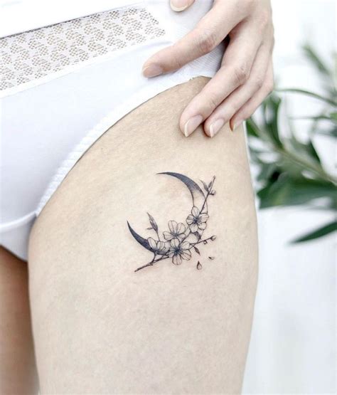 Moon Tattoos: Upper Thigh Crescent Moon With Cherry Blossoms | Moon tattoo wrist, Crescent moon ...