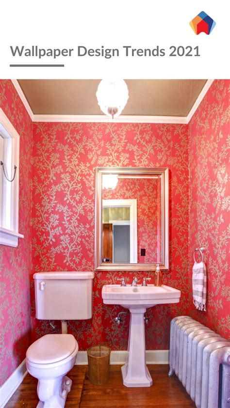 a bathroom with red wallpaper and white sink, toilet and radiator in it