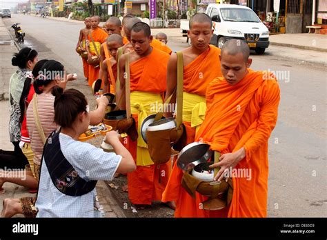 Morning round of buddhist monks begging for alms or Tak Bat, Luang Stock Photo: 60372287 - Alamy