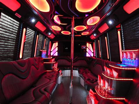 This red party bus has really cool lights and an epic bar on the right. This would be a really ...