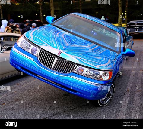 Blue Lincoln Town Car Jacked Up Stock Photo - Alamy