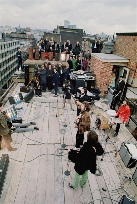 The Beatles perform on the roof of Apple Records in January 1969 (With images) | The beatles ...