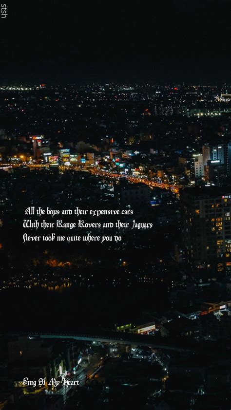 an aerial view of the city at night, with a quote written in white on it