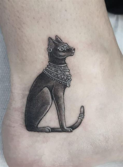 an egyptian cat tattoo on the ankle