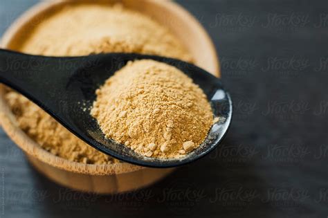 "Powdered Maca Root In Spoon" by Stocksy Contributor "Kristin Duvall" - Stocksy