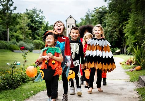 Free Photo | Young kids trick or treating during halloween