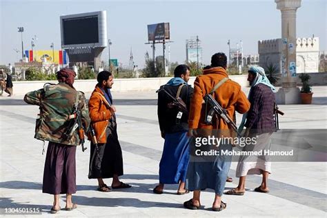 Houthi fighters take part in a funeral of Houthi fighters who were ...