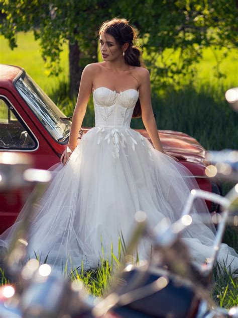 Wedding dress with bustier bodice and floral embroidery