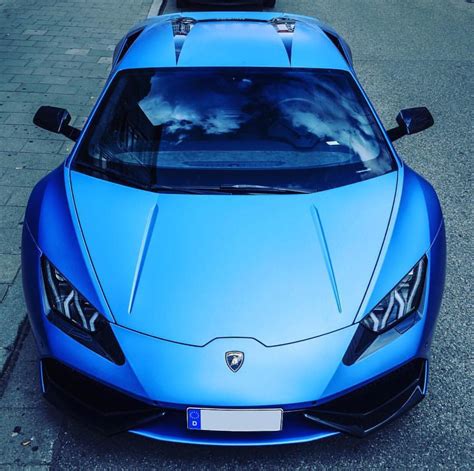 Lamborghini Huracan wrapped in Satin Chrome Blue w/ gloss Black accents around the headlights ...