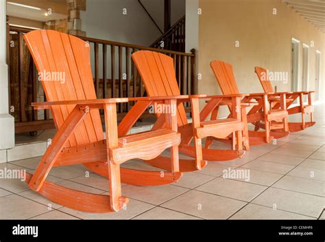 Wooden rocking chairs hi-res stock photography and images - Alamy