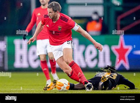 LIEGE, BELGIUM - DECEMBER 10: Jan Vertonghen of Benfica, Fessal Tapsoba of Standard Liege (on ...