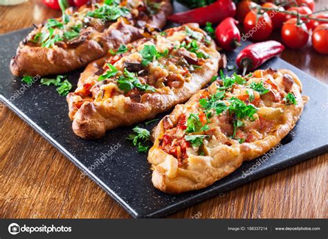 Traditional Turkish pide with meat and vegetables — Stock Photo © fotek #188337214