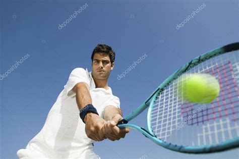 Tennis Player Hitting Ball — Stock Photo © londondeposit #33800487