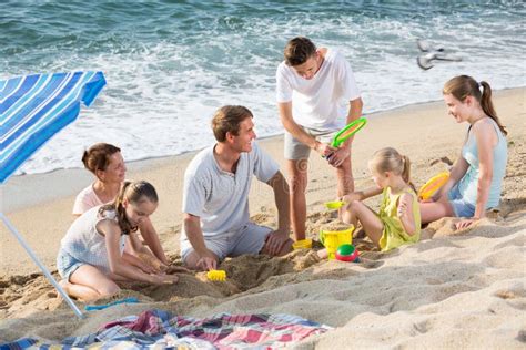 Family with Four Kids Relaxing on Beach Stock Photo - Image of holiday, positive: 83813686