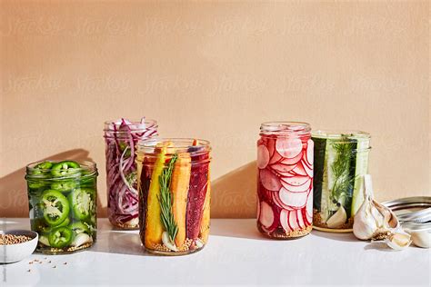 "Assorted Pickled Jars" by Stocksy Contributor "JChong Studio" - Stocksy