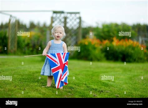 Adorable little girl with United Kingdom flag outdoors Stock Photo - Alamy