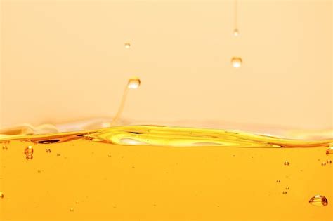 yellow liquid with bubbles floating in the air