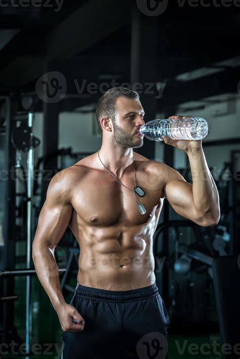 Man drinking water in gym 939960 Stock Photo at Vecteezy