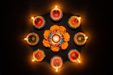 Premium Photo | Happy Diwali - Clay Diya lamps lit Hindu festival of lights celebration.