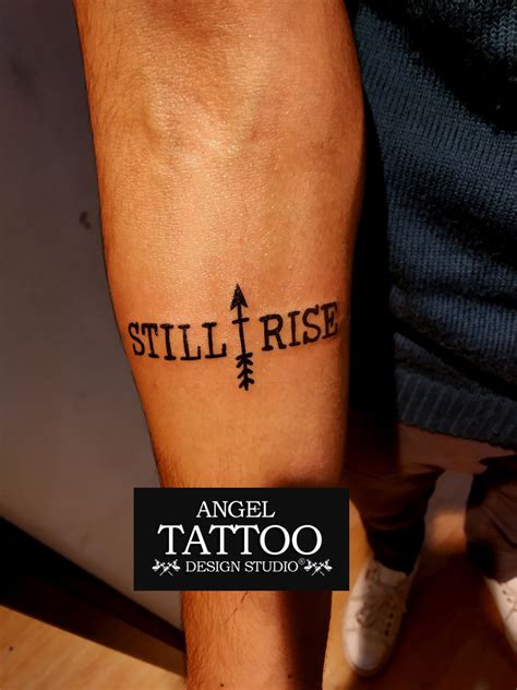 Still i rise tattoo with arrow made at gurgaon shop ; call 8826602967 ...