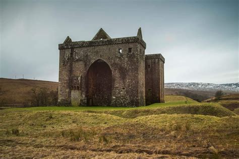 Hermitage Castle in Copshaw Holm, Roxburghshire. A semi-ruined castle of the traditional motte ...